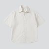 RAA-AY unisex off-white 100% cotton boxy fit bowler shirt with subtle textured pattern on shoulders and vertical stripes.